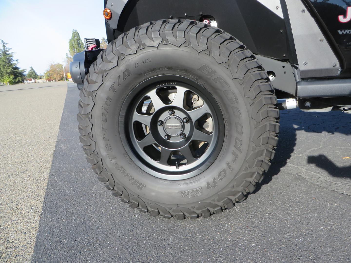 2018 BLACK /BLACK Jeep Wrangler JL Unlimited Rubicon (1C4HJXFG0JW) with an 3.6L V6 DOHC 24V engine, automatic transmission, located at 2630 Grass Valley Highway, Auburn, CA, 95603, (530) 508-5100, 38.937893, -121.095482 - JL Rubicon sitting on Teralfex suspension, Falken fast adjust shocks, Method wheels, BFG KM3 tires, Smittybilt winch, Rigid Leds, window tint, RC Fender eliminators, DV8 rear bumper, Smittybilt HD hinge kit, and a terflex spare tire relocation. - Photo#8